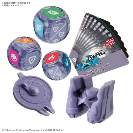 Componentes de Plakoro Starter Set 08 Metagross: figura, dados de energía, cartas y contador de vida sobre fondo blanco